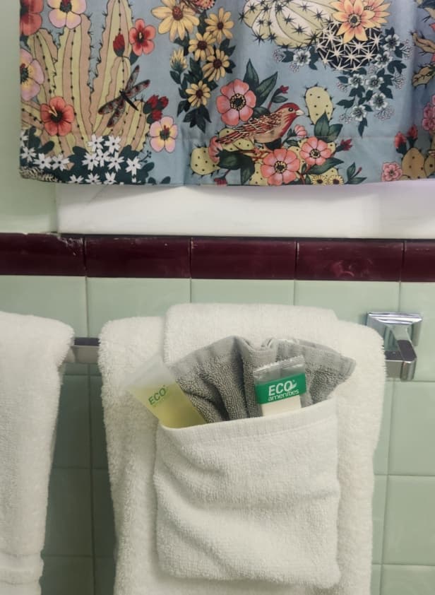 bath towels with soap and shampoo in towel fan